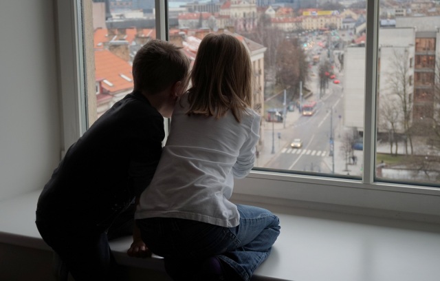 Our little people, looking out our hotel room window.