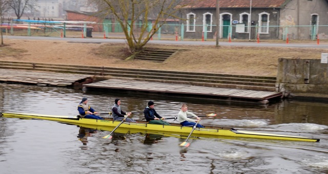 I spotted this crew rowing on the river that runs through town.  There is a shell house of sorts in the background.