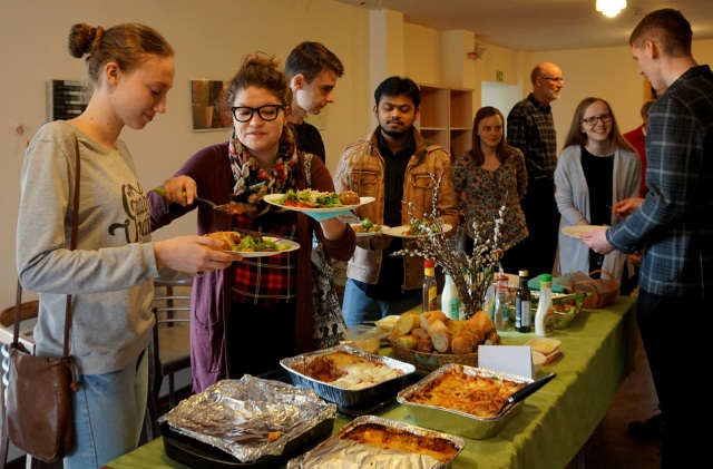 Students getting food at an end-of-year theology department dinner.